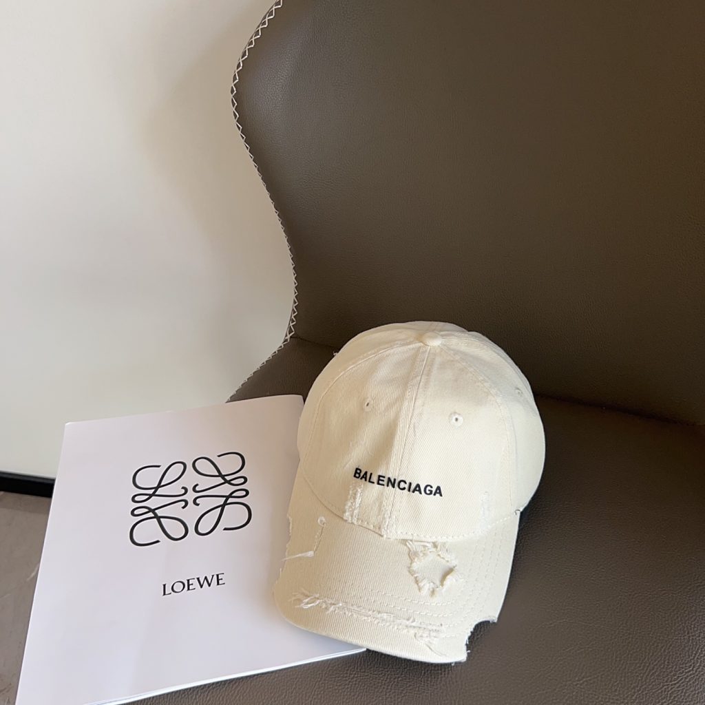 The New Balenciaga Asymmetrical Distressed Baseball Cap